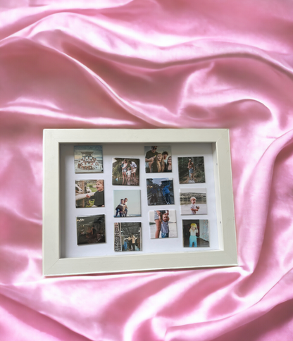 white magnetic frame with photo magnets on pink silk